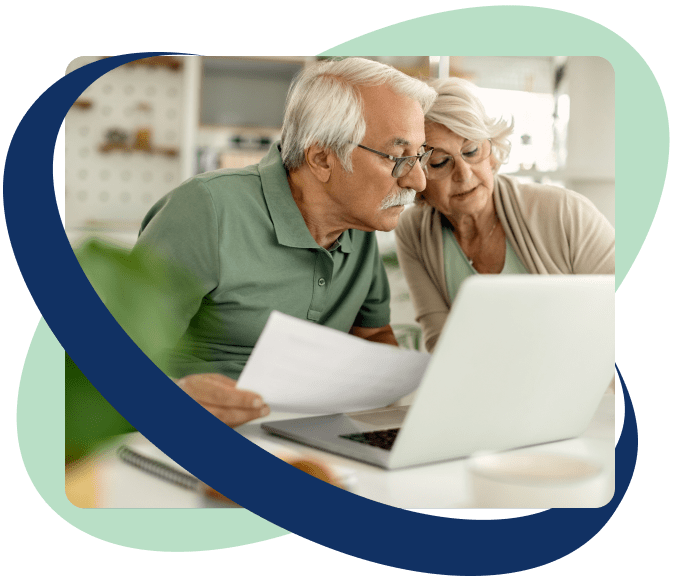 elderly couple looking at papers